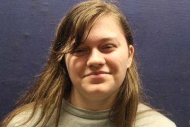 Headshot of a boy with long hair